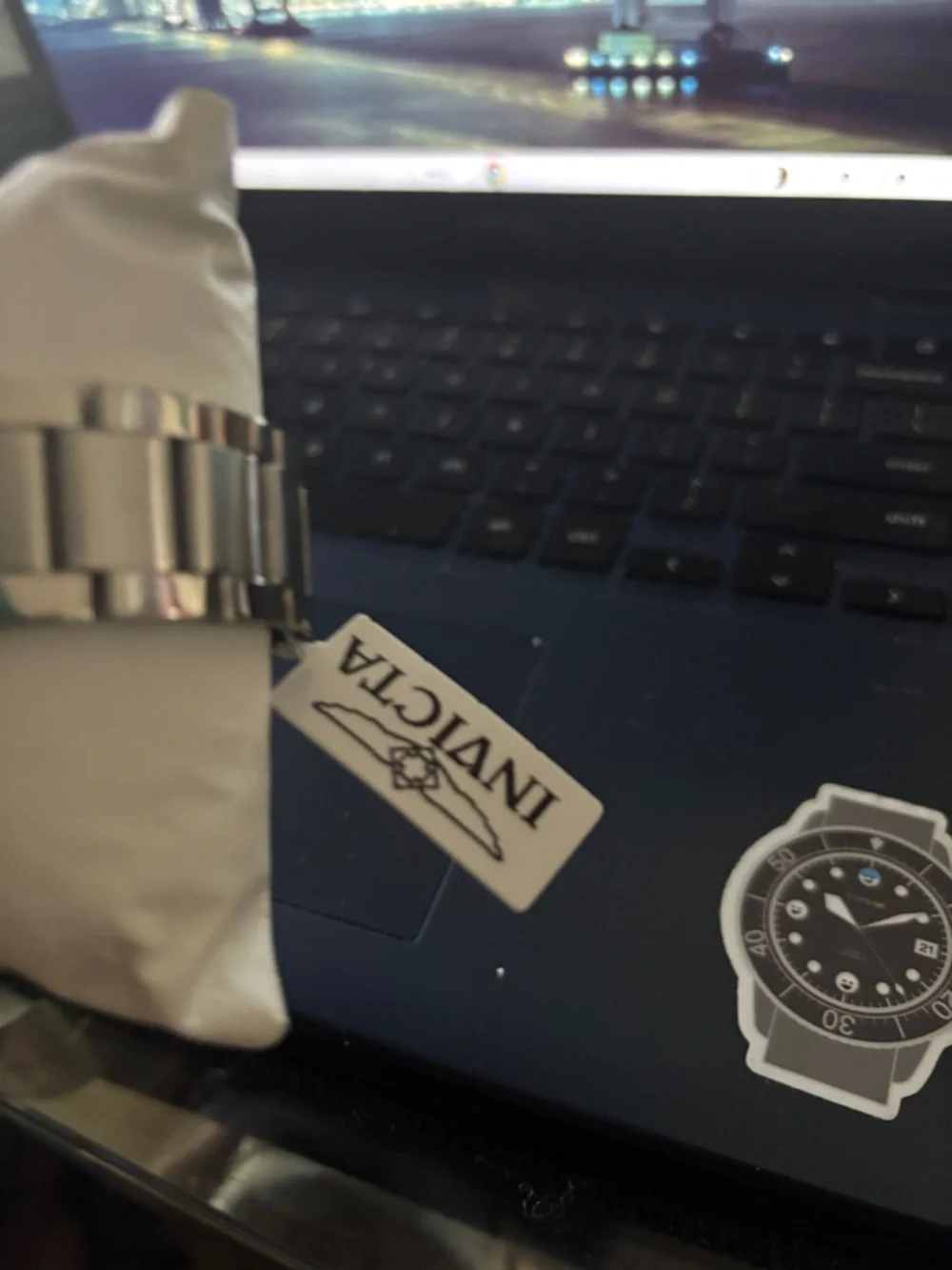 Invicta Silver Watch with Blue Hands and Roman Numerals